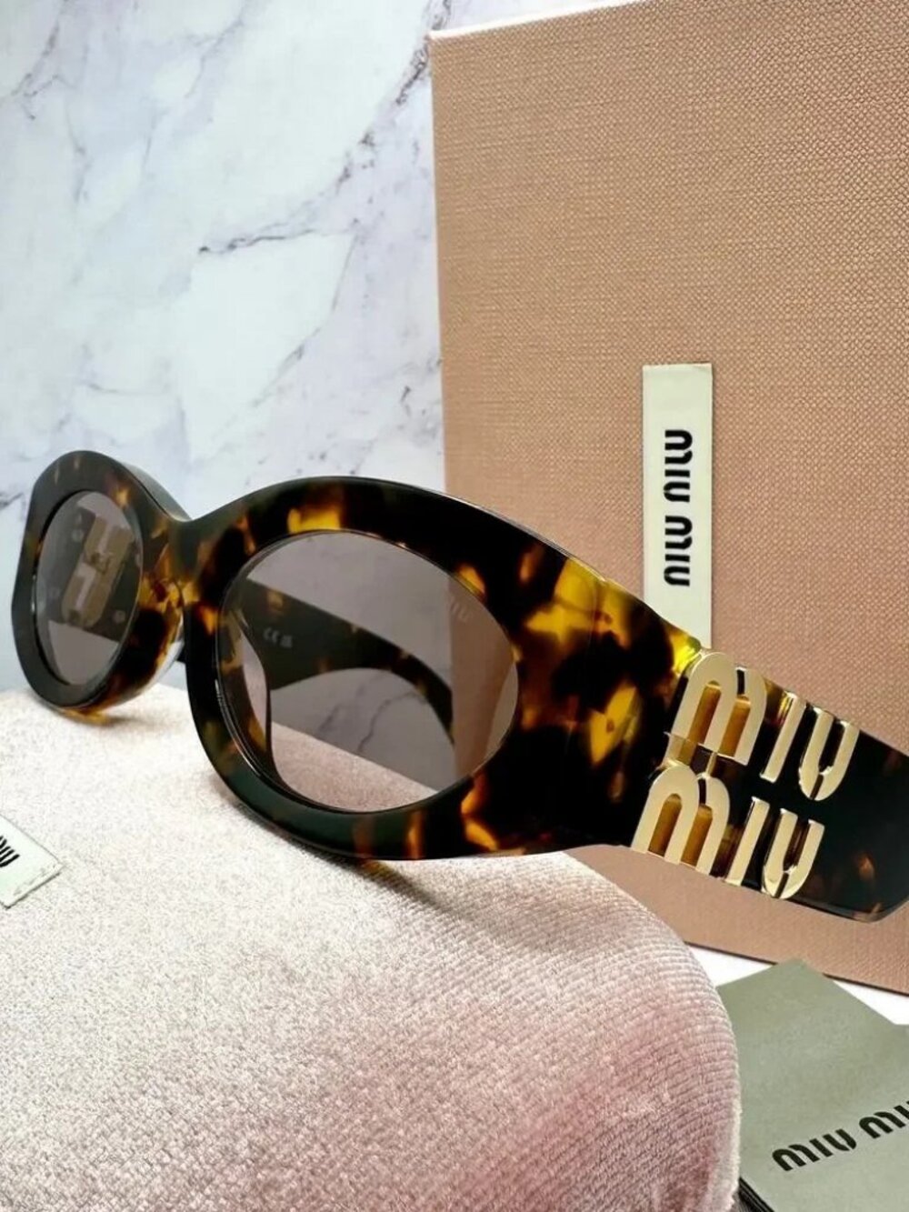 🕶️ Miu Miu Tortoiseshell Cat-Eye Sunglasses with Oversized Gold Logo ✨